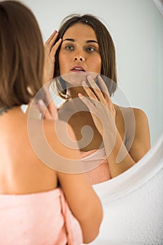 Woman using mirror