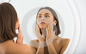 Woman using mirror