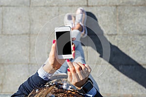 Woman using mobile phone photo