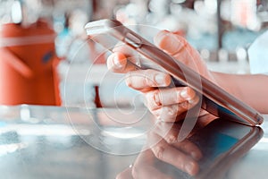 woman using a mobile phone in a cafe