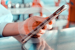 woman using a mobile phone in a cafe