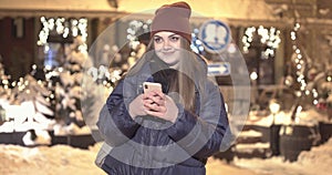 Woman using Mobile Phone of Night Town