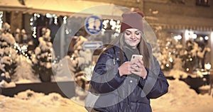 Woman using Mobile Phone of Night Town