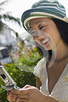 Woman using mobile phone outdoors