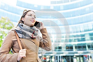 Woman using mobile phone outdoors