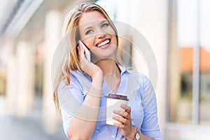 Woman using mobile phone outdoors