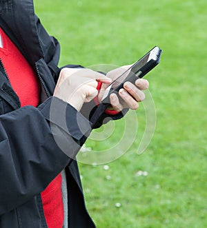 Woman using mobile phone outside