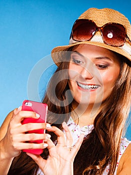 Woman using mobile phone reading sms or texting