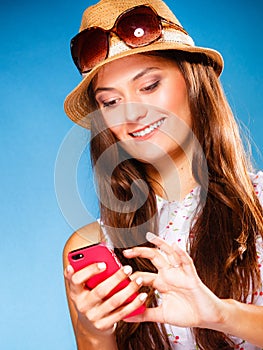 Woman using mobile phone reading sms or texting