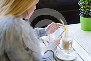 Woman using mobile phone side view