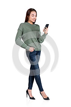 Woman using mobile phone, smiling isolated over white background
