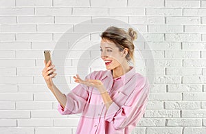 Woman using mobile phone for video chat