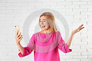 Woman using mobile phone for video chat