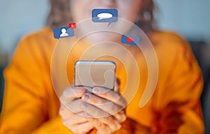 Woman using mobile with social network notifications icons