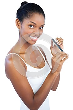 Woman using nail file