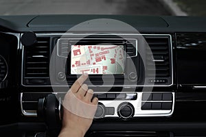 Woman using navigation system while car, closeup