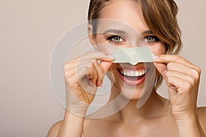 woman using nose applicator mask