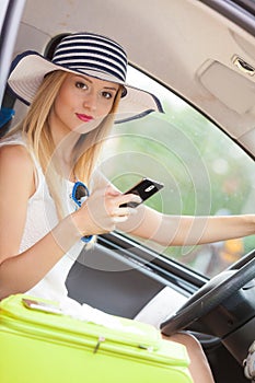 Woman using phone while driving her car