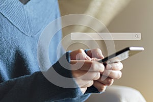 Woman using phone with search bar