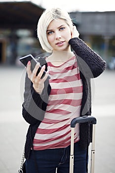 Woman using phone when traveling with public transport