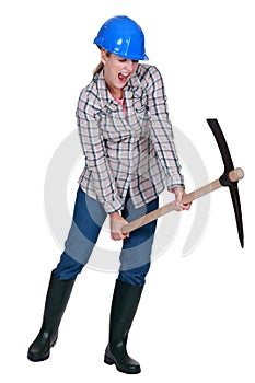 Woman using pick-ax