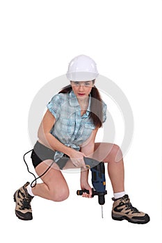 Woman using a power tool