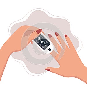 Woman using pulse oximeter device on finger