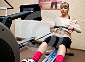 Woman using rowing machine