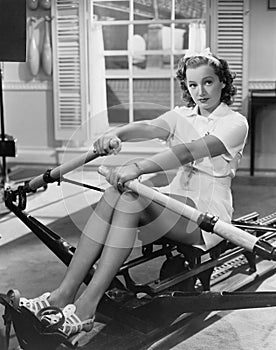 Woman using rowing machine