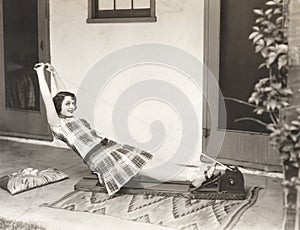 Woman using rowing machine at home