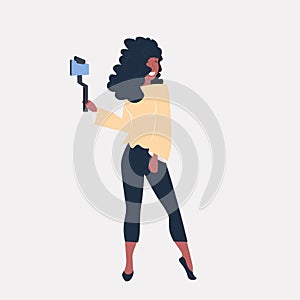 Woman using selfie stick african american girl taking photo on smartphone camera social media network blogging concept