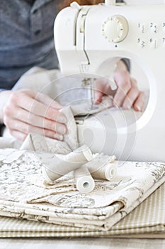 Woman using sewing machine