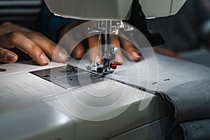 Woman using sewing machine