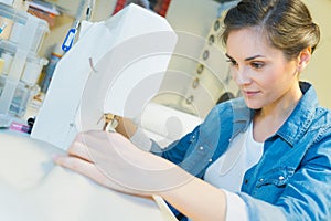 Woman using sewing machine