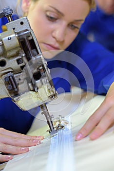 woman using sewing machine