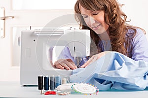 Woman using sewing machine