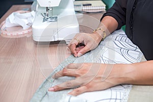 A girl sewing machine for bed sheets do it herself