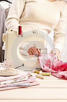 Woman using sewing machine