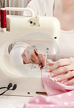 Woman using sewing machine