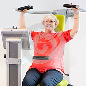 Woman using shoulder machine