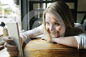 Woman Using Smart Phone Coffee Shop Concept