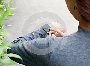 Woman using smart watch on hand new modern lifestyle