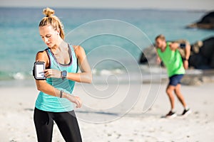 Woman using smartphone on armband