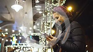 Woman using smartphone in the city