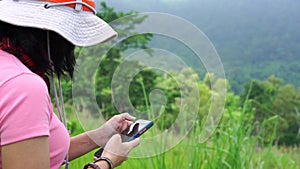 Woman using smartphone for communication on vacation time.