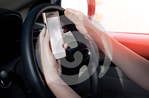 Woman using a smartphone while driving car between driving because addict social media