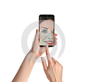 Woman using smartphone with facial recognition system on white background. Biometric verification