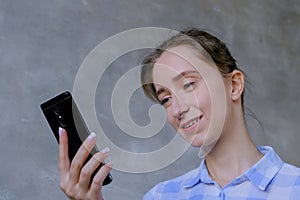 Woman using smartphone, having video chat, interview or consultation