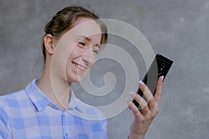 Woman using smartphone, having video chat, interview or consultation