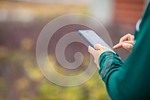 Woman using smartphone outdoors